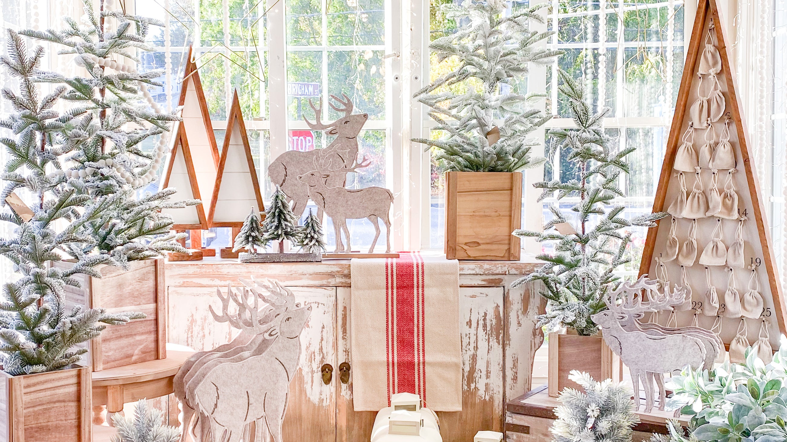 This Advent calendar tree stands about 53-inches-tall, and tucked inside, each calendar date features a little canvas sack hung on antique-looking tacks.