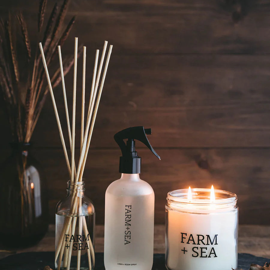 Farm and Sea diffuser, room spray, and glass candle in fir tree scent.