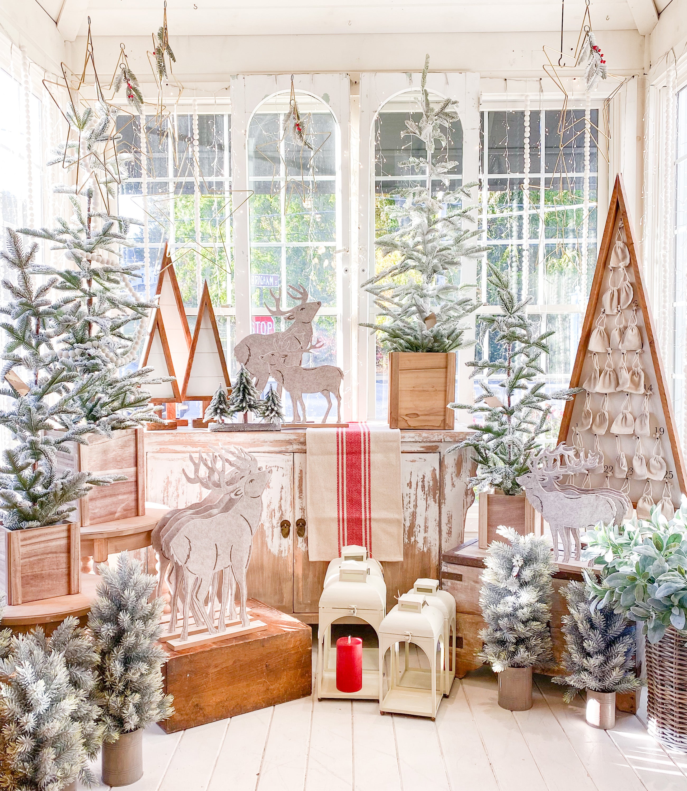 This Advent calendar tree stands about 53-inches-tall, and tucked inside, each calendar date features a little canvas sack hung on antique-looking tacks.