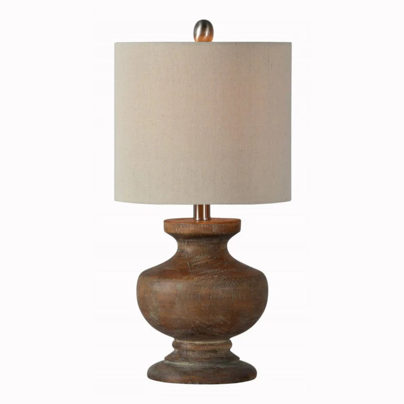 Walnut wood toned table lamp with a linen shade