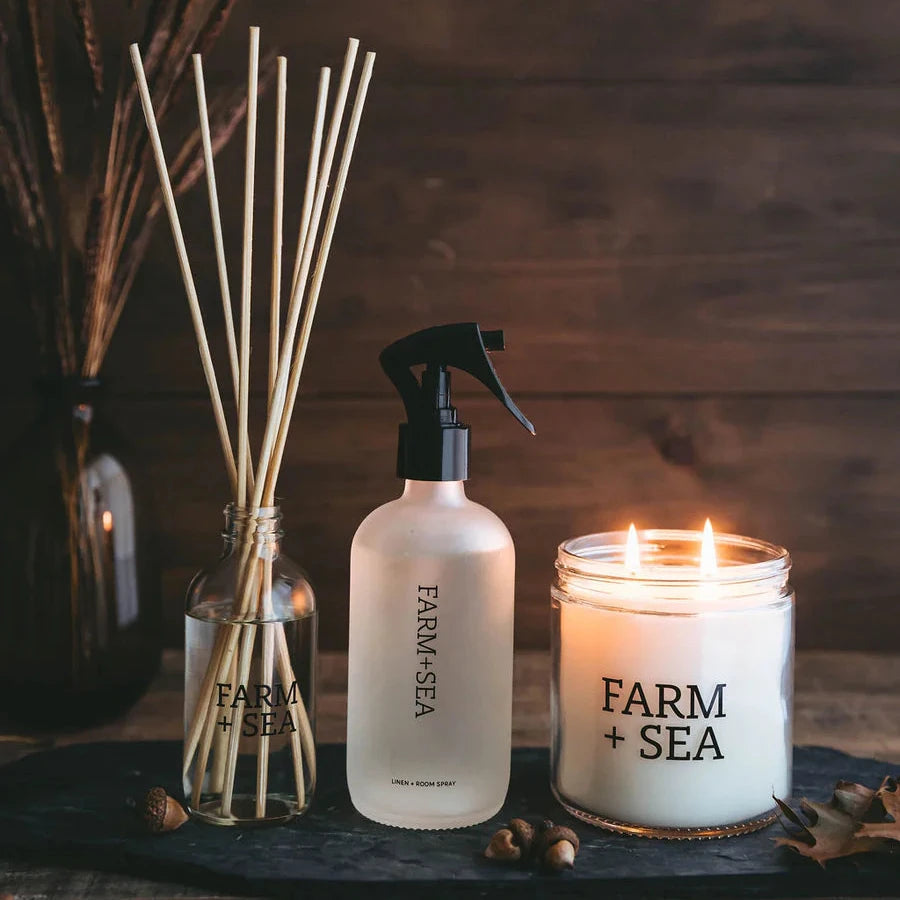 Farm and Sea diffuser, room spray, and glass candle in fir tree scent.