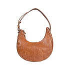 Hobo shaped tan leather bag with antique brass hardware.